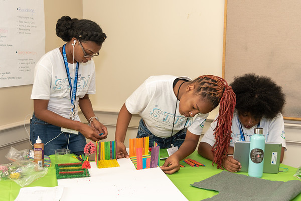 High School girls engaged in a model building project