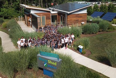 Group of students at an experimental energy efficient house