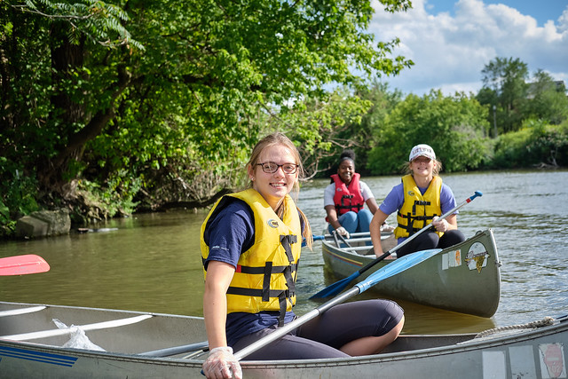Female students in canoes on River Action Day