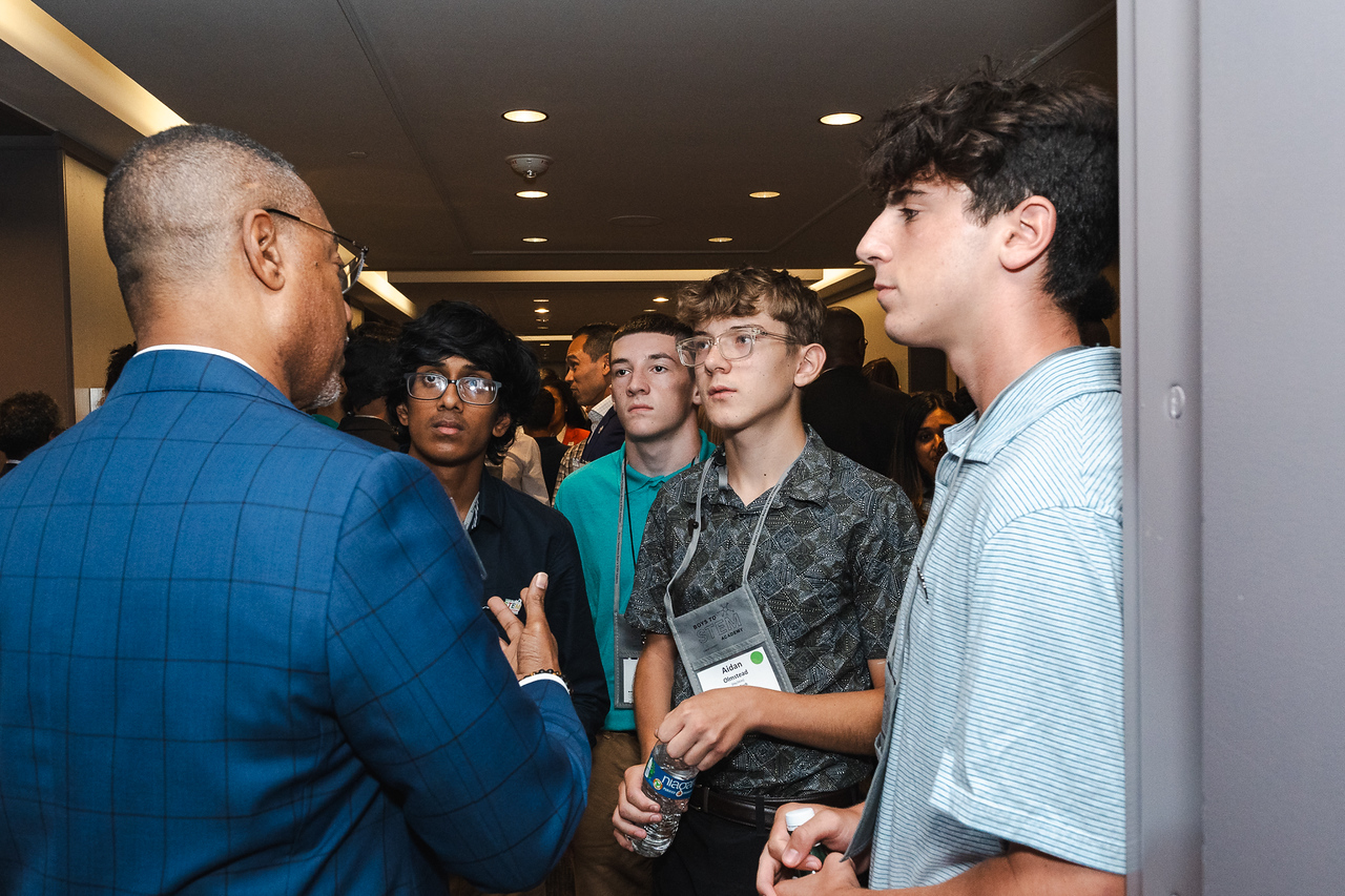 Students talking to a representative from Exelon