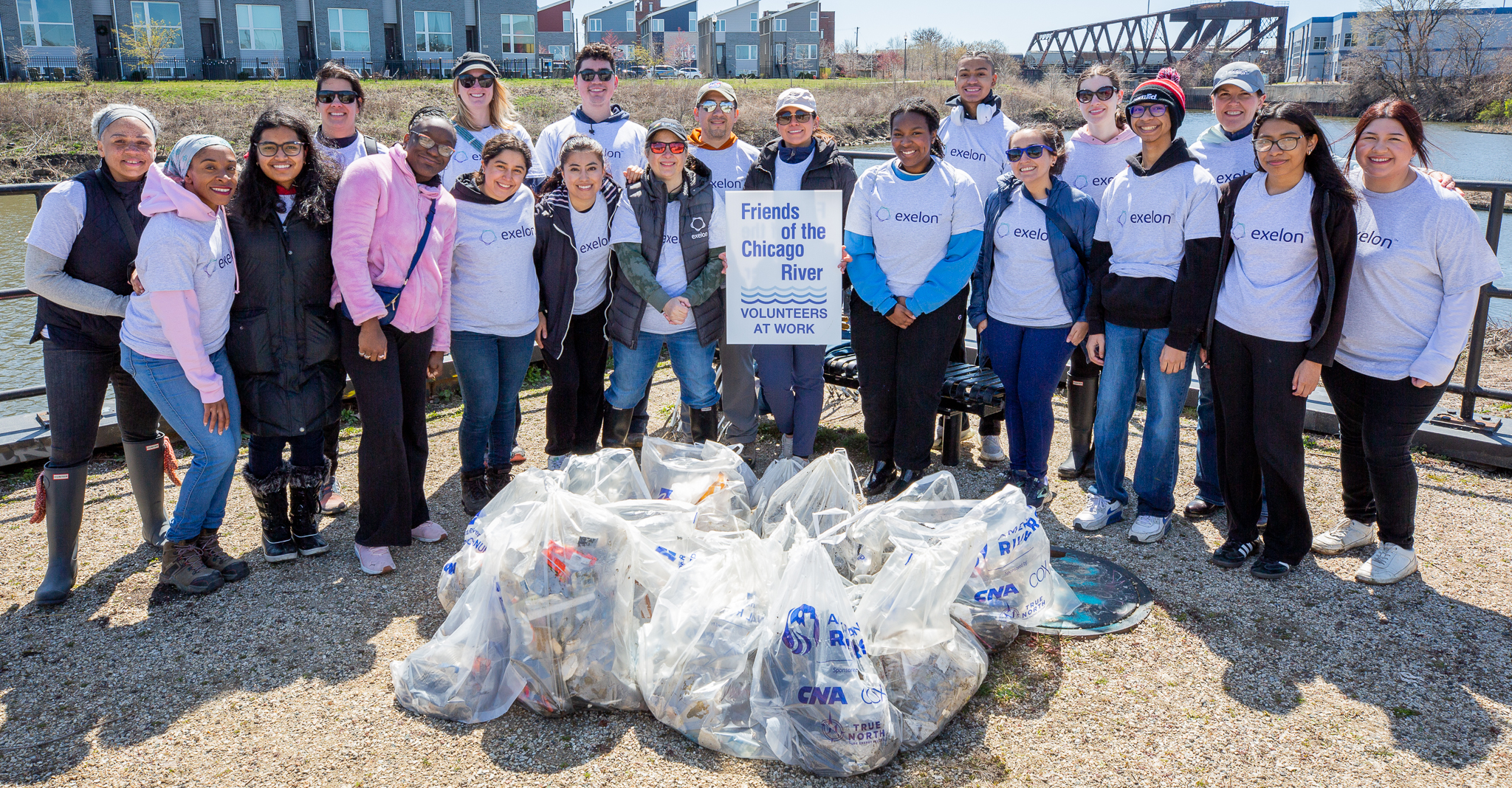 Group of students with bags of recycling