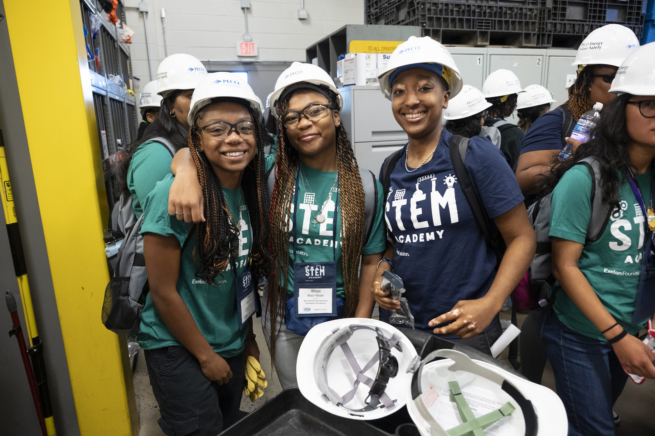 Girls in hard hats and t-shirts on a field trip