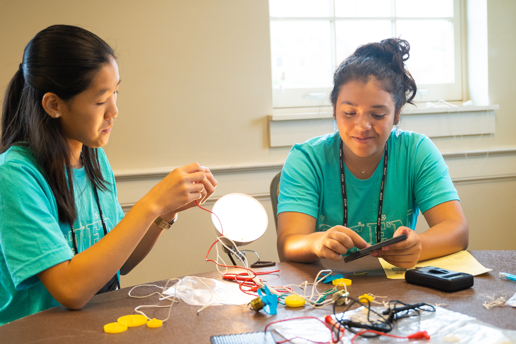 Two girls working on a STEM experiment