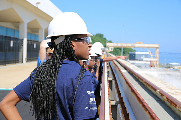 Girl in a hardhat on a train line